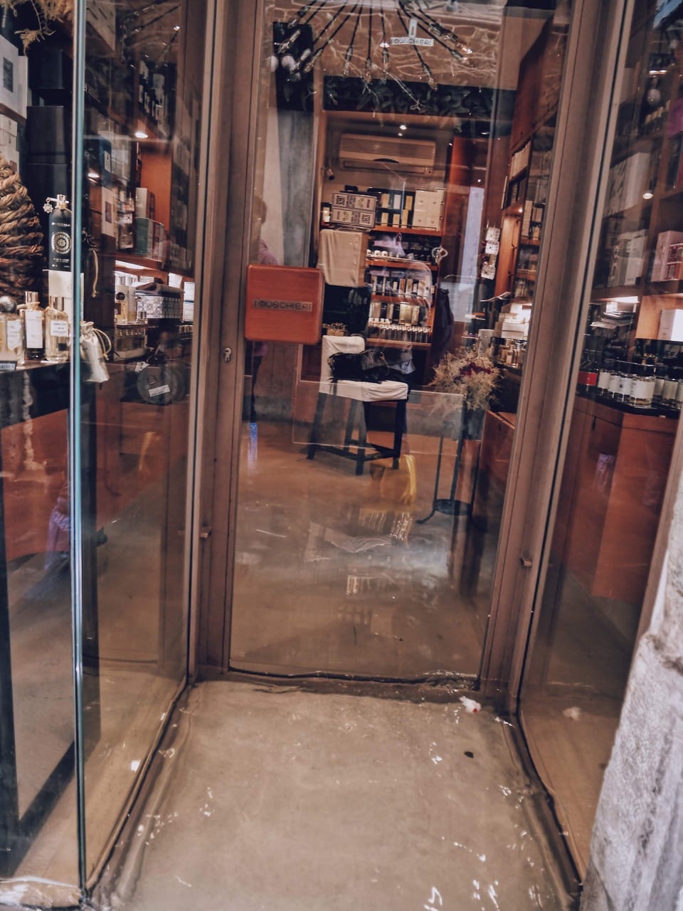 venice floodwaters outside a shop door